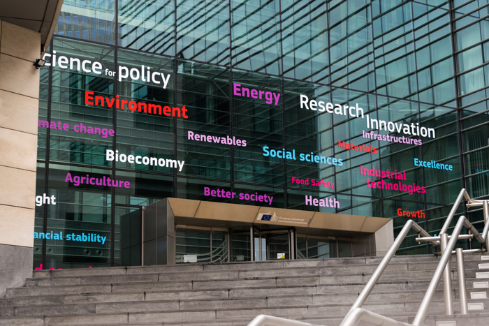 Photo of building with words related to how science helps policy